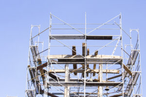 The old bell tower. Restoration of the old bell tower. Scaffolding. Old bell