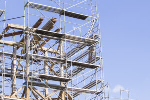 The old bell tower. Restoration of the old bell tower. Scaffolding. Old bell